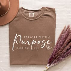 a t - shirt that says, created with purpose ephesians 2010 on it