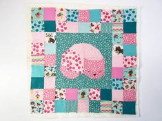 a patchwork quilt with an elephant on it