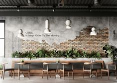 an empty restaurant with tables and chairs in front of a brick wall that reads coffee, it brings order to the morning