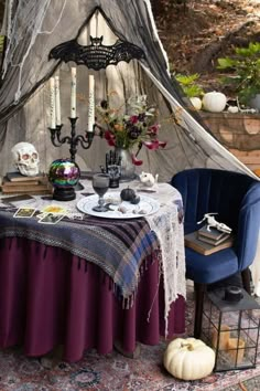 the table is set up for halloween dinner