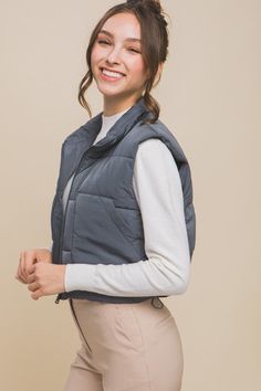 The puffer vest with pockets is a versatile and stylish wardrobe essential, seamlessly blending warmth with functionality. The quilted design not only provides insulation but also adds a trendy touch to any outfit. With strategically placed pockets, this vest offers practicality for storing small essentials while on the go, making it a practical and fashion-forward choice for cooler weather.Made in China Style: Casual Print / Pattern: Solid Silhouette: Vest Fit: Regular Embellishment: Front Pock Puff Vest, Vest With Pockets, Cropped Zip Up, China Style, Stylish Wardrobe, Cropped Vest, Vest Pattern, Judy Blue Jeans, Romper Dress