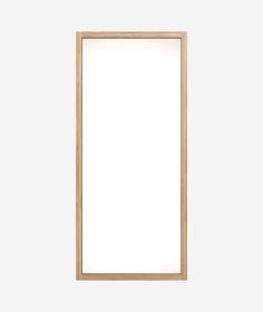 an empty wooden frame on a white wall