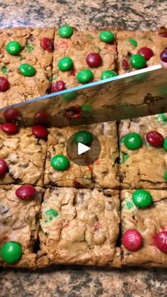 a knife cutting into some christmas cookie bars