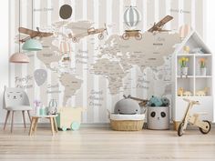 a child's room with a world map wallpaper