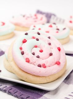 cookies with frosting and sprinkles on a plate