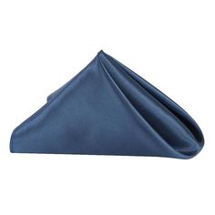 a blue napkin folded on top of a white surface