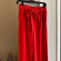 Elegant Express Pants With Wide Bottoms. Chic Red Bottoms For Spring, Elegant Red Summer Bottoms, Red Spring Workwear Bottoms, Red Bottoms For Spring Workwear, Red High Waist Bottoms For Spring, High Waist Red Bottoms For Spring, Red High-waist Bottoms For Spring, Red Long Pants For Spring, Chic Red Spring Bottoms