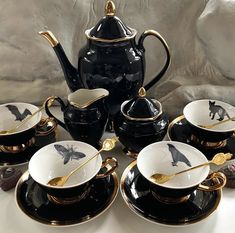 black and white porcelain tea set with gold accents