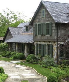 an inviting mountain house open to long range and garden views with bark siding, cedar shake roof, stone walls, and large windows. by MGPB Architects. www.mgpb.com Bark Siding, Old Stone Houses, Landscape Designer, Mountain House, Rustic Cabin, Landscape Design