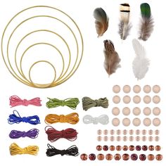 an assortment of different types of feathers, beads and other items on a white background