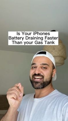 a man holding up a sign with the caption saying, is your iphone battery draining faster than your gas tank?