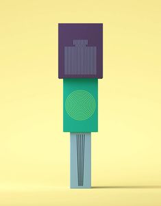 a tall green and purple object sitting on top of a yellow surface