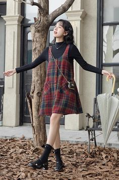 Button up mini cami dress with front pockets and an a-line tent silhouette for an easy roomy fit. S: 33" chest, 32" lengthM: 34.5" chest, 32" lengthL: 36" chest, 32" length Plaid A Line Dress, Dresses With Under Shirts, Cute Outfits For Rectangle Body Shape, Winter Mini Dress Outfit, Dress Over Long Sleeve Shirt, Flannel Over Dress, Winter Outfits Chubby, Turtle Neck Under Dress, Grunge Christmas Outfit