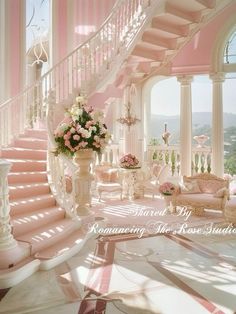 a pink and white staircase with flowers in the center next to couches, chandeliers and chairs