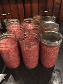 several jars filled with food sitting on top of a table