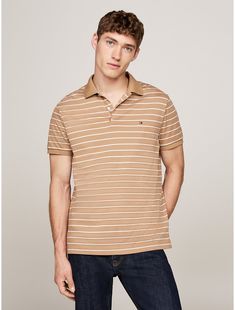 Tommy Hilfiger men's polo. This polo shirt is crafted from pure cotton with a smooth finish, lending a sleek look to the traditional design.  Material: 100% Better Cotton Initiative. Cotton Polo, Tommy Hilfiger Man, Sleek Look, Traditional Design, Men's Polo, Pure Cotton, Sweater Top, Mens Polo, Tommy Hilfiger