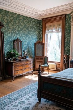 an old fashioned bedroom with green wallpaper and blue floral pattern on the walls, along with antique furniture