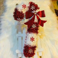 a sled decorated with red and white decorations