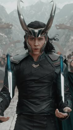 loki in the avengers movie with horns on his head and two hands out, surrounded by other