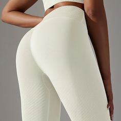 Designed with practicality in mind, our Ivory Effortless Leggings feature a wide waistband that gently hugs your curves, offering support and a flattering silhouette. Say goodbye to slipping and sliding – these leggings stay in place no matter the activity, allowing you to focus on what matters most.✔️Super soft & lightweight seamless fabric that feels like a second skin✔️Waist hugging tiered waistband to flatter your curves & prevent gaping✔️High-stretch fabric✔️High waisted✔️Seamless Cream Stretch Activewear For Sports, White High Stretch Bottoms With Contoured Waistband, Cream Stretch Sporty Activewear, Sporty Stretch Cream Activewear, Sporty Cream Stretch Activewear, Fitted Cream Activewear For Yoga, High Stretch Beige Leggings, White Compressive Elastane Leggings, White Compression Seamless Leggings