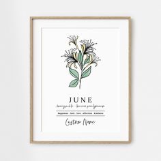 a framed poster with the name june written in black ink on it, and an illustration of flowers