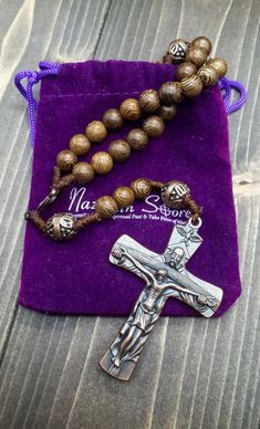 Wood Rosary Beads Necklace Beautiful Our Father String Knotted Rosary with Metal Cross 2.4" and Holy Mary Medal. Solid Oak Wood Beads 9.00mm polished and solidly tied to antique bronze design Crucifix with writing on the back in ancient slavic ( Polish Alike ) "Holy Spirit" strengthen me with your gifts. Five decades rosary connected to devout 59 beads perfectly designed to hold on during daily usage. wearable for most people, easy to carry in your pocket, bag, or keep in your car or home. Stron Bronze Rosary With Round Beads As Gift, Bronze Rosary As Gift, Bronze Jewelry With Wooden Beads For Gift, Knotted Rosary, Wooden Rosary, Rosary Beads Necklace, Catholic Jewelry, Metal Cross, Rosary Necklace