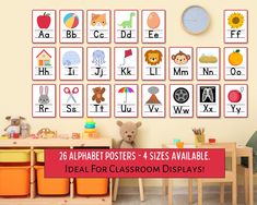 a child's playroom with lots of alphabet posters and toys on the wall