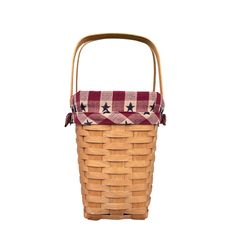 a basket with a red and white checkered blanket in it on a white background