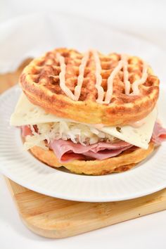 a waffle sandwich with ham and cheese on it