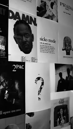 black and white photograph of posters on the wall in front of a man's head