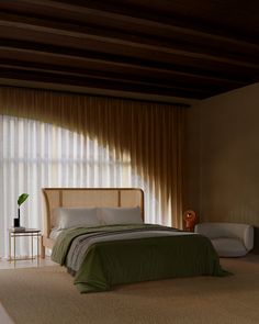 a bedroom with a bed, nightstands and curtains in front of a window that has vertical blinds