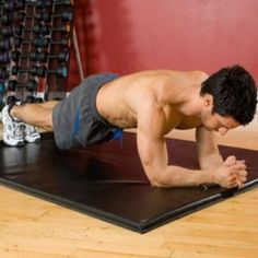 a man is doing push ups on a mat