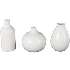 three white vases sitting next to each other