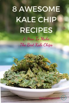 a white bowl filled with kale chips sitting on top of a table next to a pool