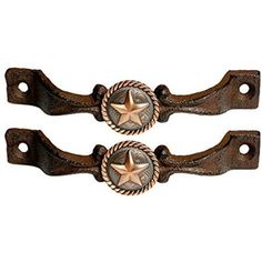 two brown and gold metal handles with stars on them