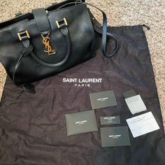 100% Authentic Ysl Cabas Calfskin Bag With Ysl Monogram Base Length: 11.5 In Height: 8 In Width: 6 In Drop: 3.5 In Drop: 17 In Comes With Dust Bag Strap Authentic Card Matching Leather Brand Card Ysl Uptown Small Tote, Yves Saint Laurent Tote Bag, High-end Black Monogram Canvas Bag, Ysl Bag Matte Black, Ysl Black Large Bag, Yves Saint Laurent Bags, Monogram Bag, Bag Straps, Calf Skin