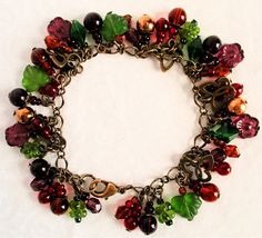 Purple Flower Beaded Cluster Bracelet - Juicybeads Jewelry Brass Butterfly, Cluster Bracelet, Cluster Bracelets, Red And Brown, Brown And Green, Glass Flowers, Crown Jewels, Plum Purple, Butterfly Charm