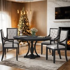 a dining table with chairs around it in front of a christmas tree and fire place