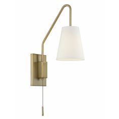 a wall light with a white shade on the side and a metal pole attached to it