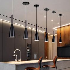 modern kitchen with bar stools and hanging lights