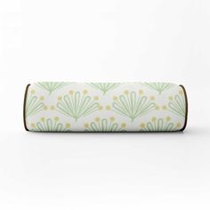 a green and white case with an art deco design on the front, sitting in front of a white background