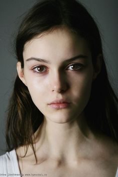 a woman with brown eyes and long hair