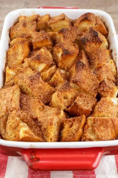 a casserole dish filled with cinnamon french toast on a red and white checkered table cloth