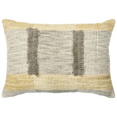 a gray and yellow pillow with fringes on it