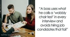 two people sitting at a table with a book in front of them and one person holding a clipboard