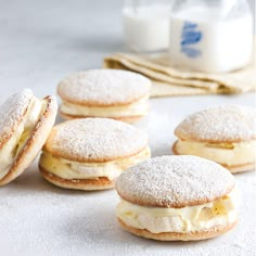 several pastries sitting on top of a white counter