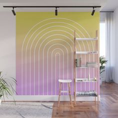 a room with a large wall mural in pastel colors and a ladder leaning against the wall