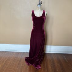 Rich garnet red velvet tank dress with wide straps. Scoop neck & curve-hugging silhouette. Pulls over. Unlined. Designer: Roberta Made in the USA Fabric: 100% Polyester Color:  garnet red Condition:  Pre-owned in very good condition.   Size: Size Medium MEASUREMENTS (inches)  Underarm to underarm: 16-19 Waist flat across: 14-15.5 Hip flat across: 18-20 Length of side seam: 49 Length: 60 Elegant Scoop Neck Maxi Dress For Party, Red Sleeveless Velvet Evening Dress, Red Velvet Sleeveless Evening Dress, Sleeveless Velvet Dress For Night Out, Fitted Sleeveless Velvet Dress, 1990s Fashion Women, 90s Velvet Dress, Whimsical Gothic, Stretch Velvet Dress