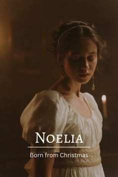 a woman wearing a white dress with the words noella written on it in front of her