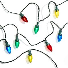 multi - colored christmas lights are hanging on a white background